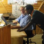 Manager and team member in site office