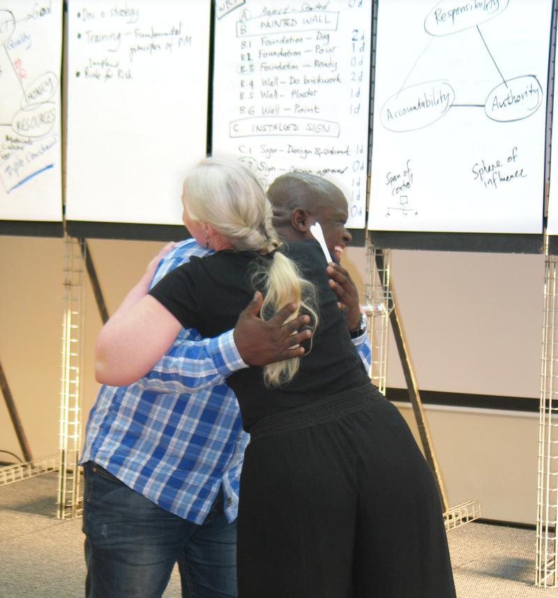 Facilitator congratulates winner of the prize draw.