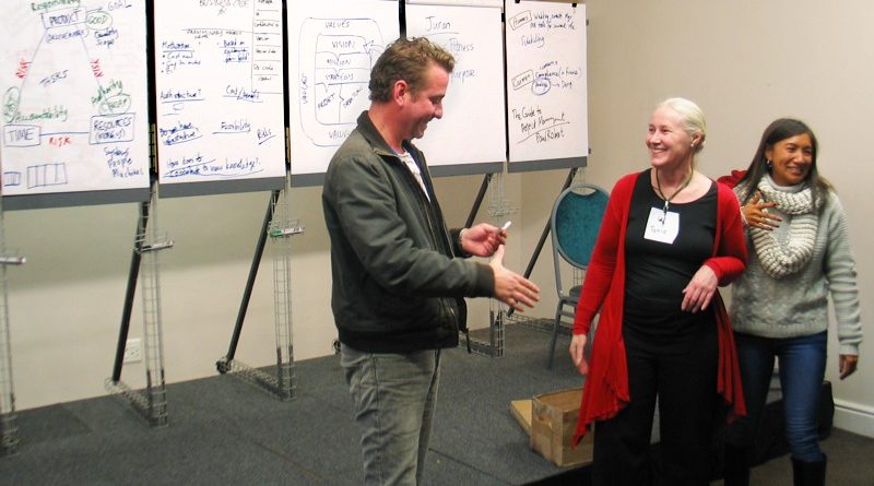 Wedding planner Hannes wins a prize draw at the ProjectManagement.co.za workshop